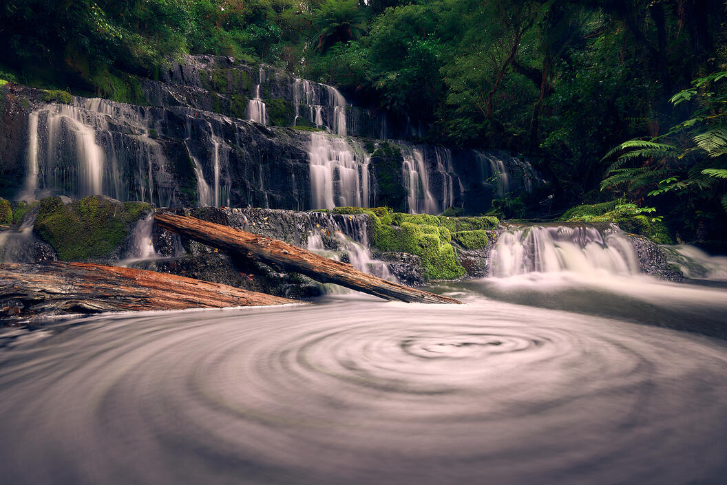 Mass start of night ultra marathon race, crowd of runners with headlamps creating sea of lights in darkness, black and white photography
